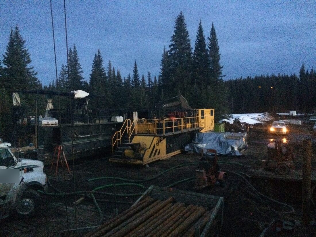Drill site at dusk in failing light, work continuing