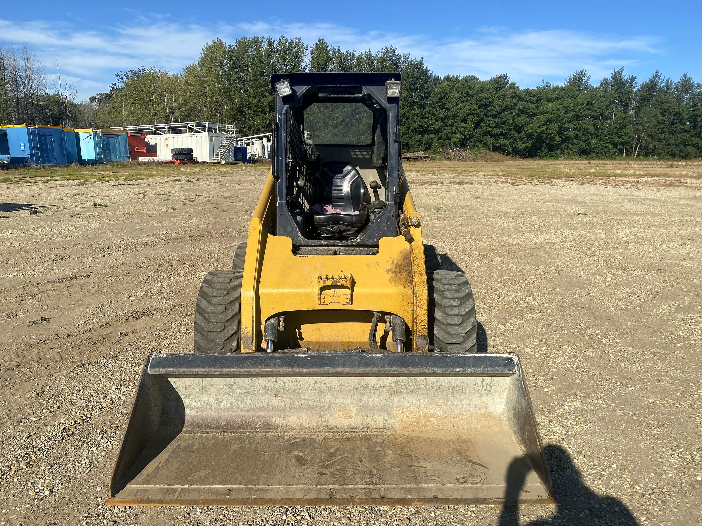 The group's Caterpillar 236 skid steer, bucket down