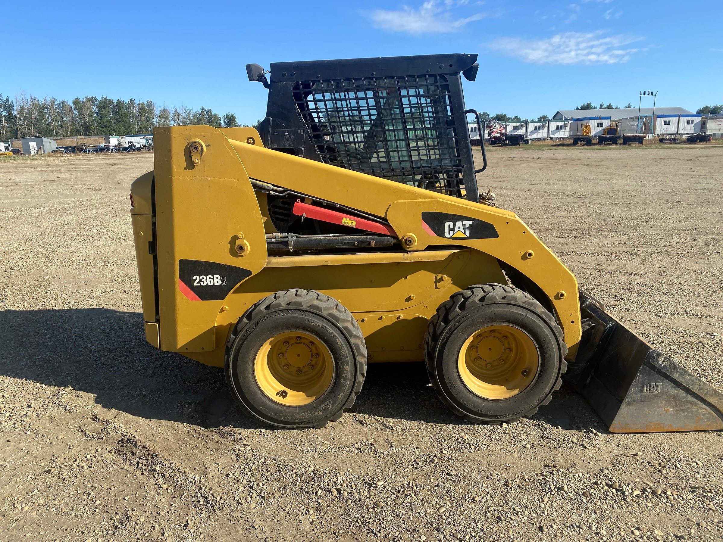 Caterpillar 236 skid steer in the yard