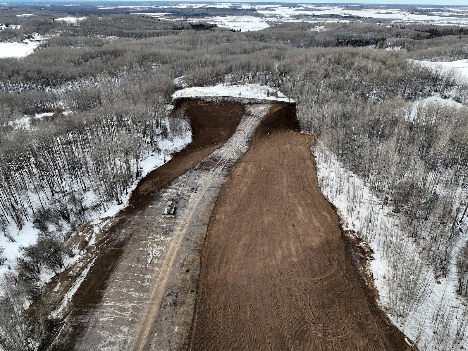 A dozer on a winter corridor, from the air
