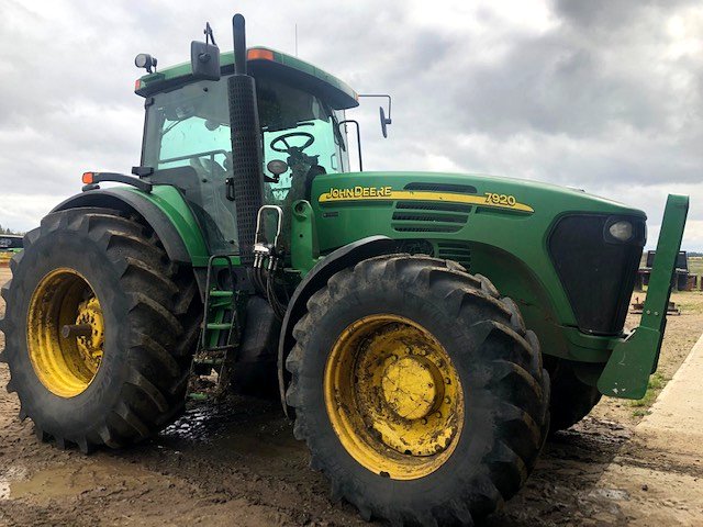 John Deere 7920 row-crop tractor in the shop yard