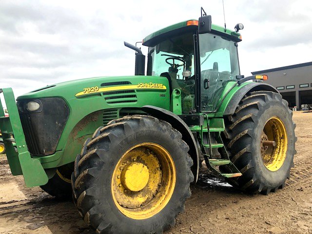 John Deere 7920 row-crop tractor, shop yard
